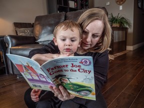 Leah and Nolan Labrie share a reading moment with a book from the Dolly Parton Imagination Library, one of the best known programs of Kids Can Fly that builds an interest in reading and strengthens bonding time between youngsters and parents.