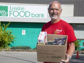 London Food Bank volunteer Bruce Walker hopes Londoners will be generous during the charity's Thanksgiving food drive that launched Friday. The food bank is experiencing its highest usage since the COVID-19 pandemic began more than 18 months ago. (Derek Ruttan/The London Free Press)