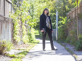 Two decades after she was beaten, knifed and sexually assaulted on this northeast London pathway, Emilie Paraskevas, 53, has returned seeking closure and new tips to lead police to her attacker. (Derek Ruttan/The London Free Press)