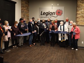 Leduc Legion president Lynda Cuppens cut the ribbon during a ceremony Oct. 26 to name the second floor multipurpose room at the Leduc Recreation Centre the Legion Room. (City of Leduc)