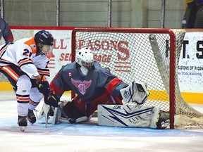 Photo by KEVIN McSHEFFREY/THE STANDARD
Elliot Lake goaltender Colton Donaldson makes the save from a Thunderbird player during the second period on Saturday.