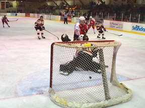 Photo by KEVIN McSHEFFREY/THE STANDARD
Red Wing Quinn Gavin-White scores the team's second goal on Beavers goaltender Eric Clark at the 13:12 mark of the first frame in Friday's game at the Centennial Arena.