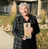 Executive director of the Volunteer Strathcona, Judy Ferguson poses with the organization’s 2021 Minister’s Seniors Service Award. Photo courtesy Facebook/Volunteer Strathcona