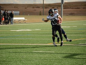 Mason Korf scores a touchdown for the Mustangs during their game against the Bow Valley Bobcats on October 7. Photo by Riley Cassidy/The Airdrie Echo/Postmedia Network Inc.