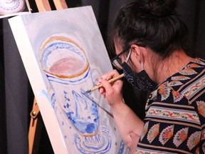 An artist comptets at Creative Combat 2020, when twelve incredible paintings were created in very short 20 minutes. Photo Marie Conboy/ Postmedia.