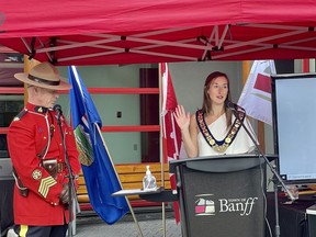 Newly elected Mayor Corrie DiManno swears in with her grandfather's bible on Oct. 25 during the official swearing-in public ceremony with Banff RCMP detachment commander Staff Sgt. Mike Buxton-Carr. Photo Marie Conboy/ Postmedia.