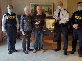 Bracebridge Ontario Provincial Police (OPP) detachment commander Inspector Burton along with Superintendent Houliston presented 80-year-old Norman Ruff of Port Carling with a Citation for Bravery on behalf of OPP Commissioner Carrique on Tuesday October 26, 2021. Ontario Provincial Police photo