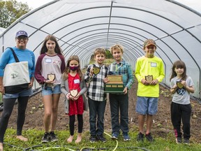 From left Vicki Emlaw, 12-year-old Abby Rimug, 8-year-old Abbigail Wemyss, 9-year-olds Oliver and Simon Hill, 11-year-old Cooper Vandenburg and 7-year-old Eve Maggiacomo hold their plaques for the 2021 ChildrenÕs Garden Awards in Prince Edward County, Ontario. ALEX FILIPE
