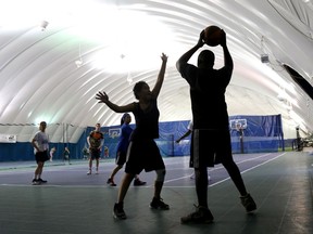 Members of Team Nunavut play basketball at Loyalist College's sports dome Tuesday, July 15, 2014. The area's health unit has issued instructions for proof of vaccination for people involved in organized indoor sports.