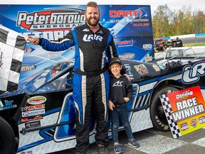 Andy Kamrath (No. 89c) celebrates in victory lane after claiming the OSCAAR Modified feature win October 10th at Peterborough SpeedwayÕs Autumn Colours Classic. MELISSA SMITS PHOTO