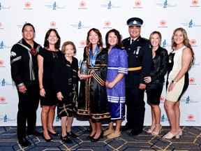 Jo-Anne Tabobandung  (middle) is pictured with her Elsie Macgill Education Award at the Northern Lights Aero Foundation Gala for Women in Aviation Saturday in Toronto. She is joined by her family members (from left) including husband Victor Tabobandung, sister Debra Reid, mother Marilyn Maracle, daughter Raven Tabobandung, bother Gary Maracle, sister in-law Brandi Maracle, and daughter Taylor-Rain Tabobandung. Daughter Kendall  Tabobandung was unable to attend. SUBMITTED PHOTO