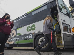 A Belleville citizen boards the Metrolinx GO-VAXX vaccination bus as he awaits to receive a dose of the COVID-19 vaccine Saturday in Belleville, Ontario. ALEX FILIPE