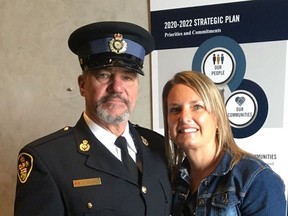 Prince Edward OPP Con. Tony Merrall and his wife Michelle are pictured with 2020 Accolade Award for Enforcement. Merrall, who will retire in January, received the award at a recent ceremony at OPP Headquarters in Orillia.