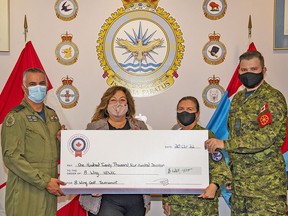 Wing Commander Colonel Ryan Deming, Patricia Guernsey, title sponsor, Master Warrant Officer Susana Keyes, 8 Wing NDWCC co-chair, and Major Dan Bennett Chair of the 8 Wing Golf Tournament display a cheque for $120,417 raised in support of the United Way Hastings Prince Edward. SAILOR FIRST CLASS ERIN ROBERTS/8 WING IMAGING