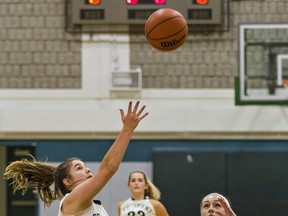 Lauren Marcos of St. John's College takes a shot during senior girls high school basketball match against the Pauline Johnson Collegiate on Sept. 23.