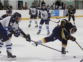 Noah Sigal of the St. George Ravens slows down an opponent during a recent Greater Metro Junior A Hockey League game.