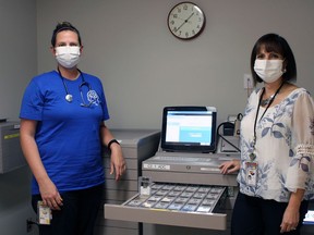 Registered nurse Cindy Baldwin (left) with Lisa Reeder, director of pharmacy with the Brant Community Healthcare System, which has installed a $2.8-million automated medication dispensing system.
