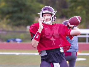 Ryan Hill of the Pauline Johnson Thunderbirds gets set to make a pass during a varsity football practice.