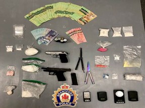 Brantford police said they seized drugs and weapons in a search Thurday of two Colborne Street motel rooms.