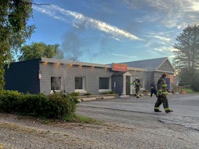 Smoke blows through the window of JJ's Country Diner on Sept. 28, after a fire destroyed the restaurant's office and smoke has damaged much of the inside of the business. (SUBMITTED PHOTO)