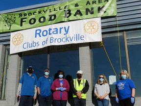 Volunteer Bill Maxwell, food drive chairman David Keenleyside, volunteers Patti Drake and Dave Paul, Brockville Food Bank operations manager Hailey Jack and volunteer Christina Covey-Shannon pose outside the drop-off location during the annual food drive last week. Marshall Healey/The Recorder and Times