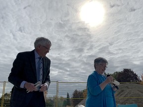 Bruce Hynes, chairman of the Marguerita Residence Corporation board of directors, shares a laugh with Sister Sandra Shannon as items are removed from a time capsule at the former St. Vincent de Paul Hospital site on Thursday morning. (RONALD ZAJAC/The Recorder and Times)