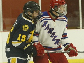 Morrisburg defenceman Owen Fetterly shadows South Grenville forward Jacob Servage in front of the Lions net during an NCJHL regular season game in October. The Jr. C Rangers and Morrisburg will meet in the opening round of the playoffs. File photo/The Recorder and Times