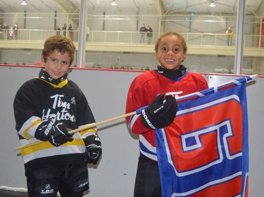 Serving as flag-bearers at the Jr. C Rangers game Saturday night were Hayden Elliott (left) of the South Grenville Initiation AB team and Simon Seabrooke of Initiation C. 
Tim Ruhnke/The Recorder and Times