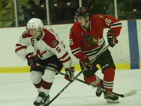 Nepean's Harris Hilfiker (left) and Brockville's Lucas Culhane respond to a puck drop at centre ice during the Raiders-Braves game at the Memorial Centre Friday night. Culhane scored an empty-netter late in the third period in Brockville's 7-5 win.
Tim Ruhnke/The Recorder and Times