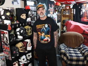 Joe Jesso, seen here in his basement in Cold Lake, collects masks from horror movies, as well as those worn by the metal band Slipknot. He started a Youtube channel, House of Strumminskull, about his hobby. PHOTO BY Myra Jesso