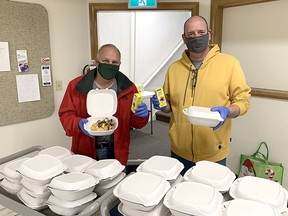 Church elder Kevin Capeling, left, and Rev. Mike Maroney are among those serving portable Saturday breakfasts from Chatham's First Presbyterian Church. The breakfast program marks 20 years on Oct. 21. Handout