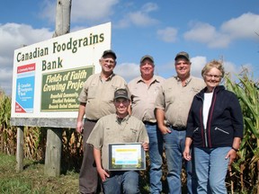 At a roadside celebration on Oct. 6, the Hill family of Varna was recognized for their 30 years as a growing partner with the Canadian Foodgrains Bank. The project is located on Mill Road between Varna and Bayfield on land owned by Hill and Hill Farms. The land was originally offered by the late Gordon Hill for the project, and succeeding generations of the family continue the tradition of service. Today, Gordon's son and daughter-in-law, Bev and Shirley Hill, his grandsons Paul and Jim and his great grandson Luke Hill are all involved in the project. Handout