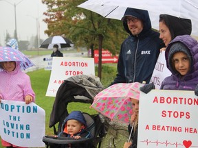 Six members of the Light family, of Ingleside, at the Life Chain silent vigil on Sunday in Cornwall. Photo on Sunday, October 3, 2021, in Cornwall, Ont. Todd Hambleton/Cornwall Standard-Freeholder/Postmedia Network