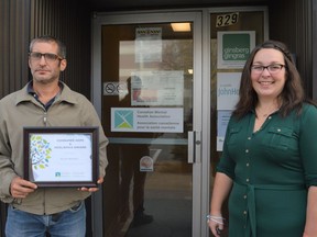 From left, the 2021 CMHA Hope and Resiliency Award winner Bryan Merkley and CMHA intensive case manager Mallory Boileau, who nominated Markley for the accolade, on Friday October 8, 2021 in Cornwall, Ont. Shawna O'Neill/Cornwall Standard-Freeholder/Postmedia Network
