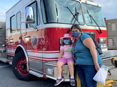 From left, Audrey and Melanie Hance checking out one of Cornwall Fire Services trucks at the Fire Prevention Open House on Tuesday August 24, 2021 in Cornwall, Ont. Shawna O'Neill/Cornwall Standard-Freeholder/Postmedia Network