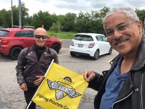 Bob Kikkert (left) and Earle DePass, during a stop along the 2021 Ride Alone Together route in Cornwall and area.Handout/Cornwall Standard-Freeholder/Postmedia Network