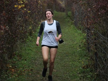 Holy Trinity's Jasmin St-Pierre, about to head out of the woods at Gray's Creek late in the junior girls race, at the 2021 SD&G Cross-country Championship. Photo on Wednesday, October 13, 2021, in Cornwall, Ont. Todd Hambleton/Cornwall Standard-Freeholder/Postmedia Network