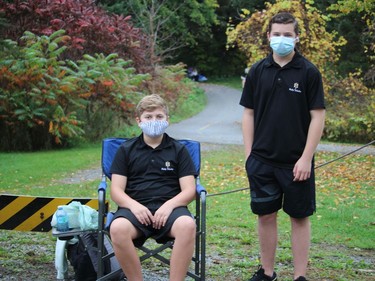 Holy Trinity students serving as volunteer course monitors at the meet included Cameron Orris (left) and Ayden Baumann. Photo on Wednesday, October 13, 2021, in Cornwall, Ont. Todd Hambleton/Cornwall Standard-Freeholder/Postmedia Network