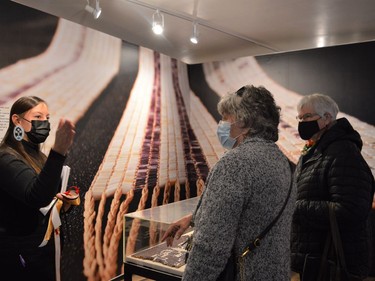 Maie Thomas discussing some exhibits at the grand reopening of the Native North American Training College on Saturday October 23, 2021 in Kawehno:ke. Shawna O'Neill/Cornwall Standard-Freeholder/Postmedia Network