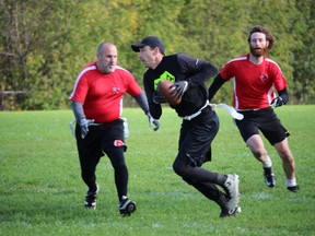 Garlow Roofing ball carrier Darcy Richer being chased by defenders Kevin Ceaser (left) and Kyle Girard. Photo on Saturday, October23, 2021, in Cornwall, Ont. Todd Hambleton/Cornwall Standard-Freeholder/Postmedia Network