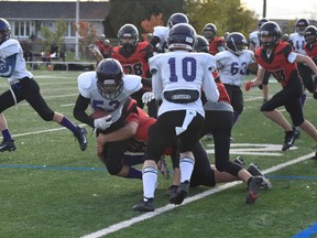 A Pam Jackman photo of Cornwall Bantam Wildcats player Reegan Peters making a tackle during a game on Sunday in Orleans, against the Gatineau Vikings. Handout/Cornwall Standard-Freeholder/Postmedia Network