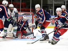 Cornwall Colts goaltender Alex Houston, centre, along with everyone else in the frame, with their eyes on an incoming shot during play against the Hawkesbury Hawks on Thursday September 30, 2021 in Cornwall, Ont. The Colts won 1-0. Robert Lefebvre/Special to the Cornwall Standard-Freeholder/Postmedia Network