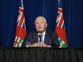 Ontario Premier Doug Ford speaks during a press conference at Queen's Park in September. On Friday, Ford announced the province's plan to end pandemic restrictions by March 28, 2022.
