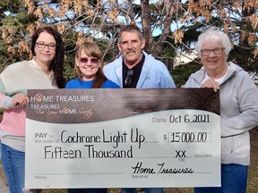 Home Treasures’ Cayley Breeze (left to right), Light Up’s Stephenie Shelstad and Rob Halfyard, and Home Treasures’ Barb Primeau pictured earlier this month with a contribution to the Light-Up event. Home Treasures