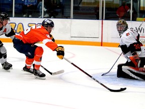 Fort McMurray Oil Barons forward Tyler Wallace carries the puck to the Lloydminster Bobcats' net at Centerfire Place on Friday, October 8, 2021. Laura Beamish/Fort McMurray Today/Postmedia Network