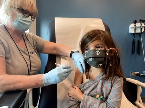 Bridgette Melo, 5, prepares for an inoculation of the Pfizer BioNtech COVID-19 vaccine during a trial at Duke University in Durham, N.C., on Sept. 28.