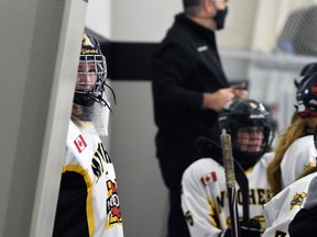 Shawnee DeJong, goalie with the Mitchell U18 girls hockey team, peaks at the clock as the game winds down in an eventual 4-3 exhibition loss to visiting Lucan Oct. 6. ANDY BADER/MITCHELL ADVOCATE