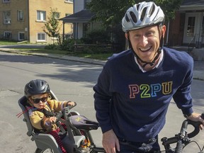 Nico Koenig, seen here with his daughter, will be participating in the Kingston Coalition for Active Transportation's bike rally beginning at McBurney Park on Saturday at 3 p.m.