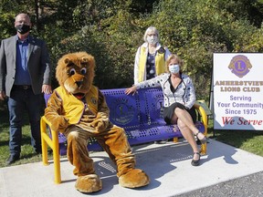 Loyalist Township Mayor Ric Bresee, back left, Joan Benoit, Amherstview Lions Club president, Wayne Weber (lion member in the lion suit) and Hazel Gilchrist, manager of human resources with Kingston, Frontenac and Lennox and Addington Public Health, are seen with the newly dedicated bench in Ridge Park in Amherstview on Wednesday.
