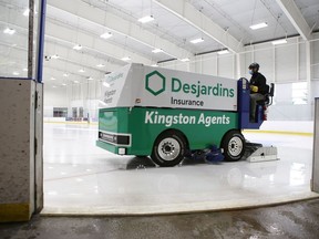 Arena operator Chris Decouto drives one of Kingston's new electric Zamboni ice-resurfacing machines at the Invista Centre in Kingston on Monday.
